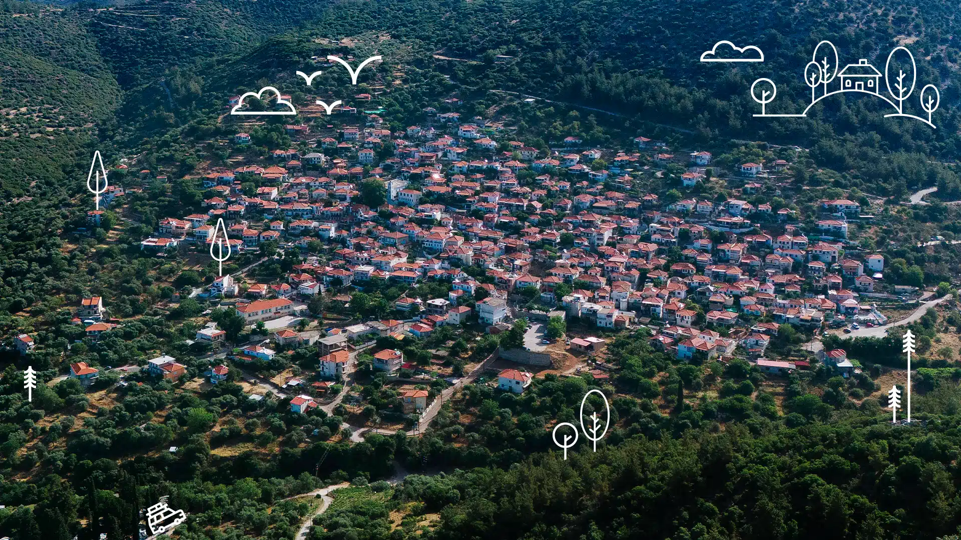Aerial view of Kallirachi, a mountain village in Thassos with orange-roofed houses on the slopes of lush green mountains Discover Thassos