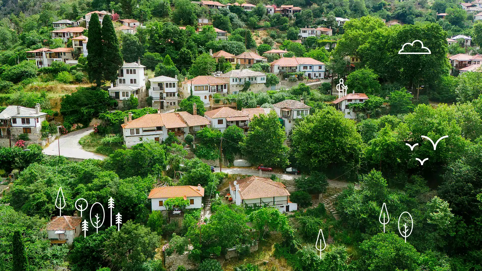 Aerial view of Kazaviti, a mountain village in Thassos with orange-roofed houses amidst thick green trees Discover Thassos